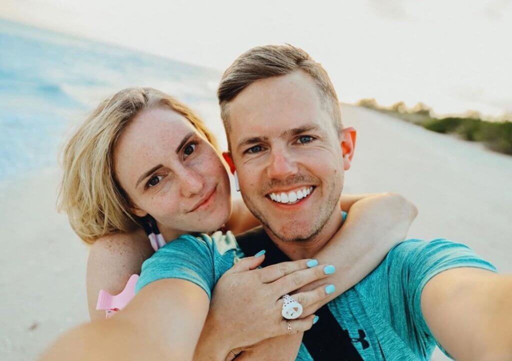 happy couple takes selfie on sanibel beach