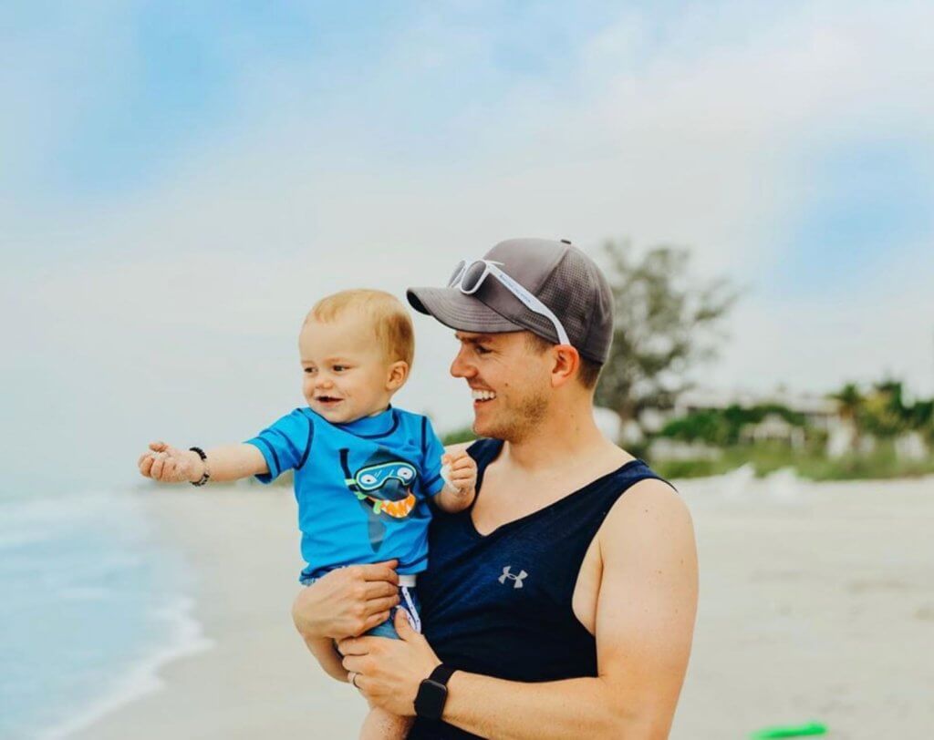 father and son play on sanibel beach