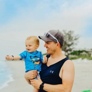 father and son play on sanibel beach